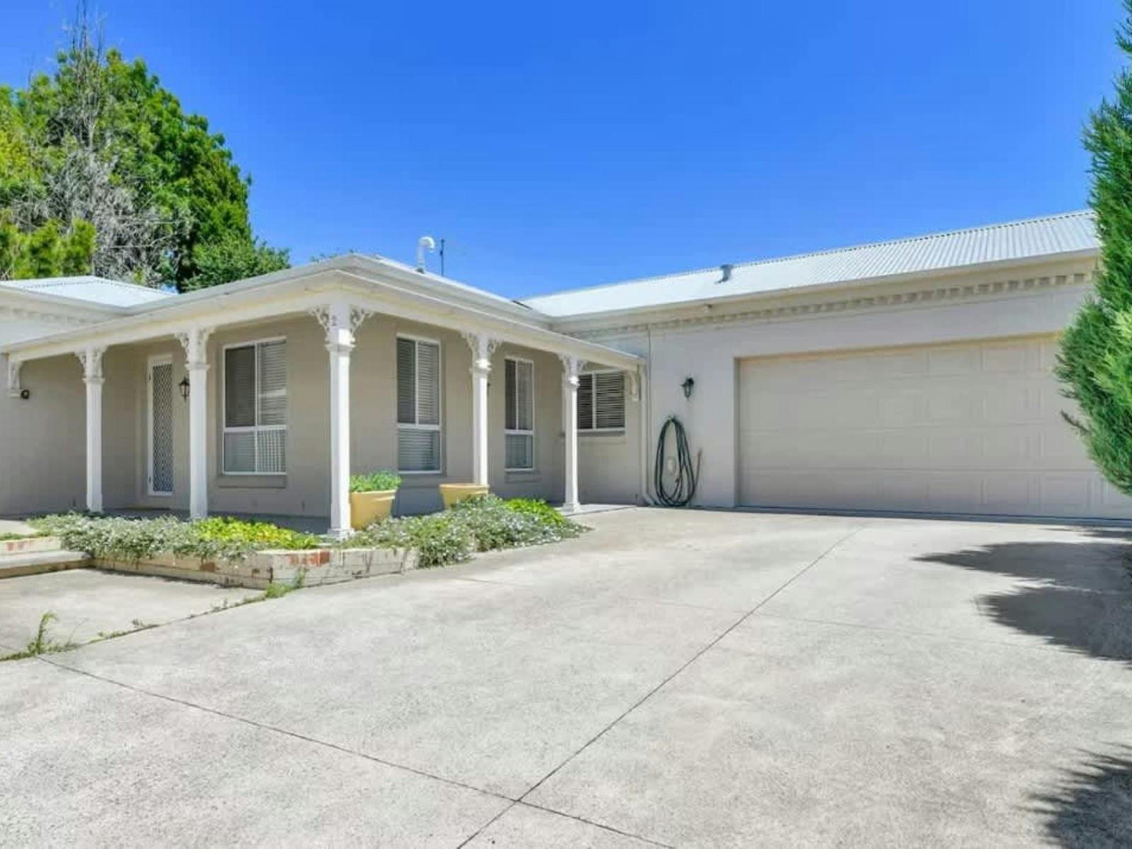 Front yard with driveway and garage