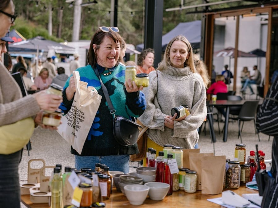 Customer purchasing pickled goods at a stall