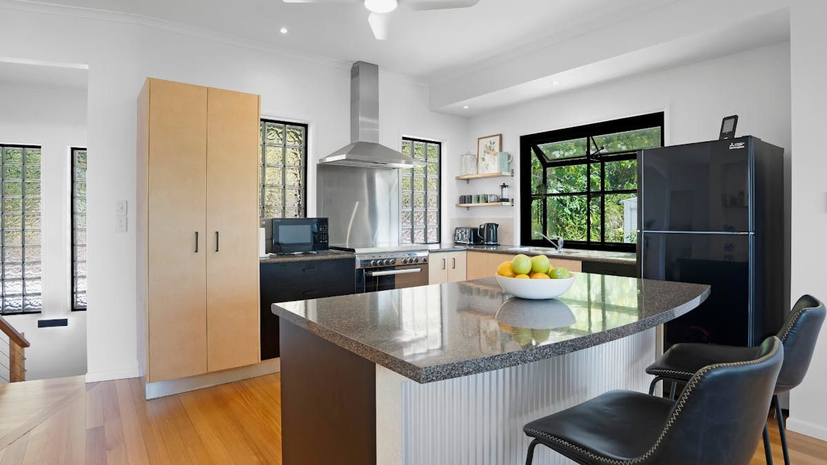 Fully equipped kitchen with gas stove and island bench