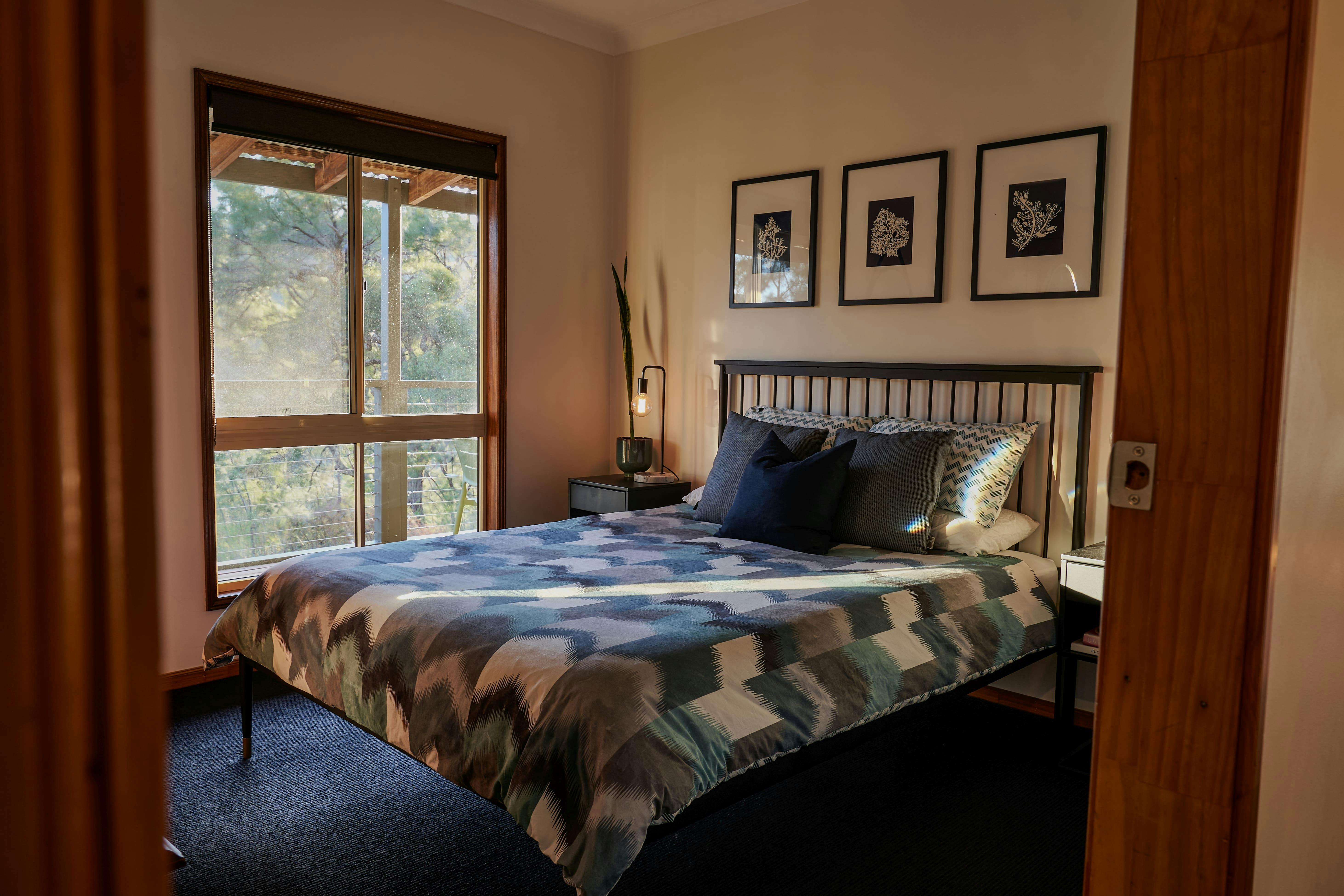 Queen sized bedroom with bushland views