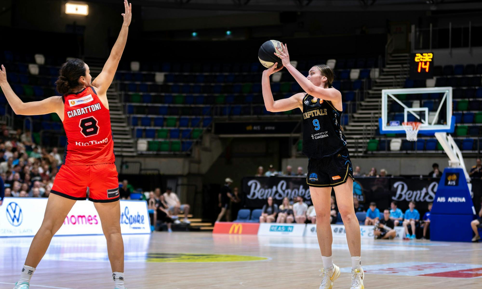 UC Capitals player shooting the basketball while a defender closes in.