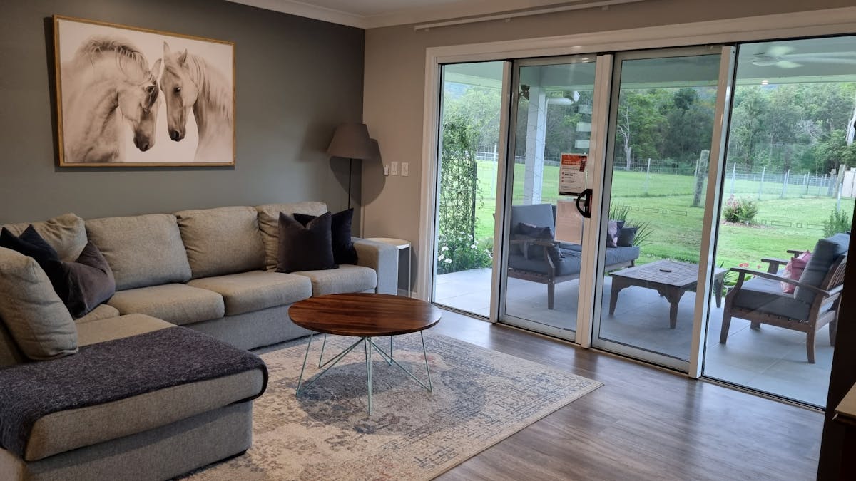 The large windows allow views of the patio and mountains beyond at Fig Tree Farm B&B. The large windows allow views of the patio and mountains beyond at Fig Tree Farm B&B.