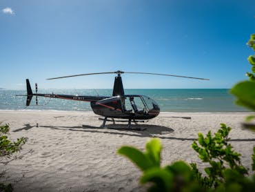 Coastal Rotors helicopter parked on Punsand Bay Beach, Cape York, ready to take flight. Coastal Rotors helicopter parked on Punsand Bay Beach, Cape York, ready to take flight.