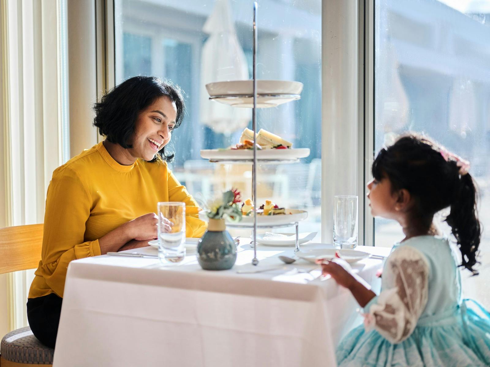 Mother and young daughter enjoying high tea at Parliament House