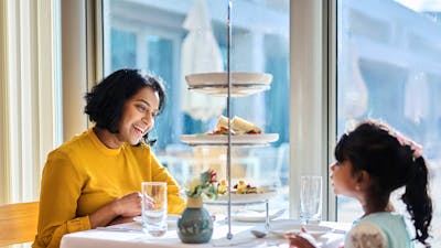 Mother and young daughter enjoying high tea at Parliament House