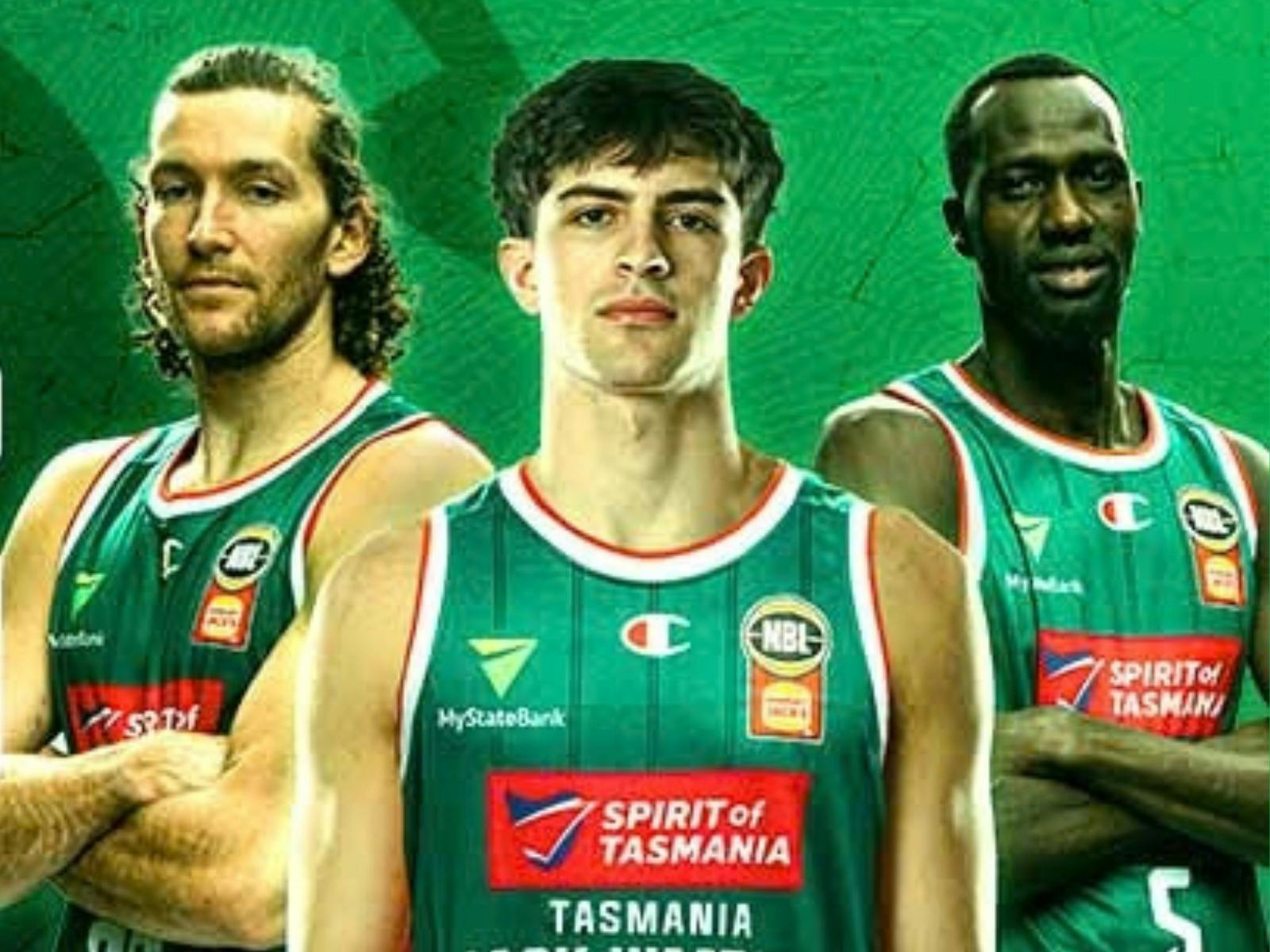 NBL players standing with arms crossed in Jack Jumpers uniform