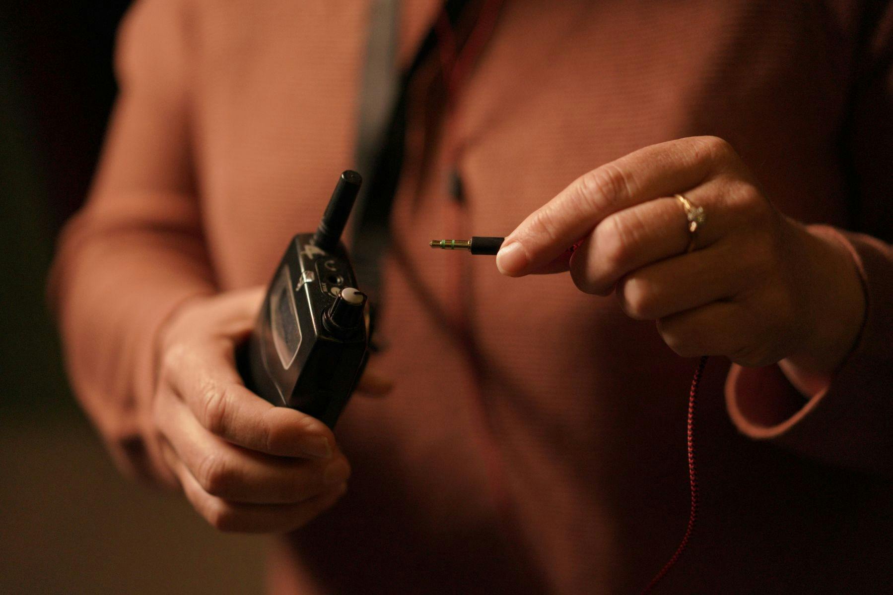 Plugging ear phones into audio unit