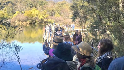 A group of people on a guided platypus walk