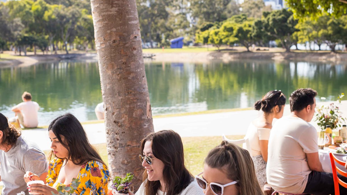 customers enjoying breakfast by the lake