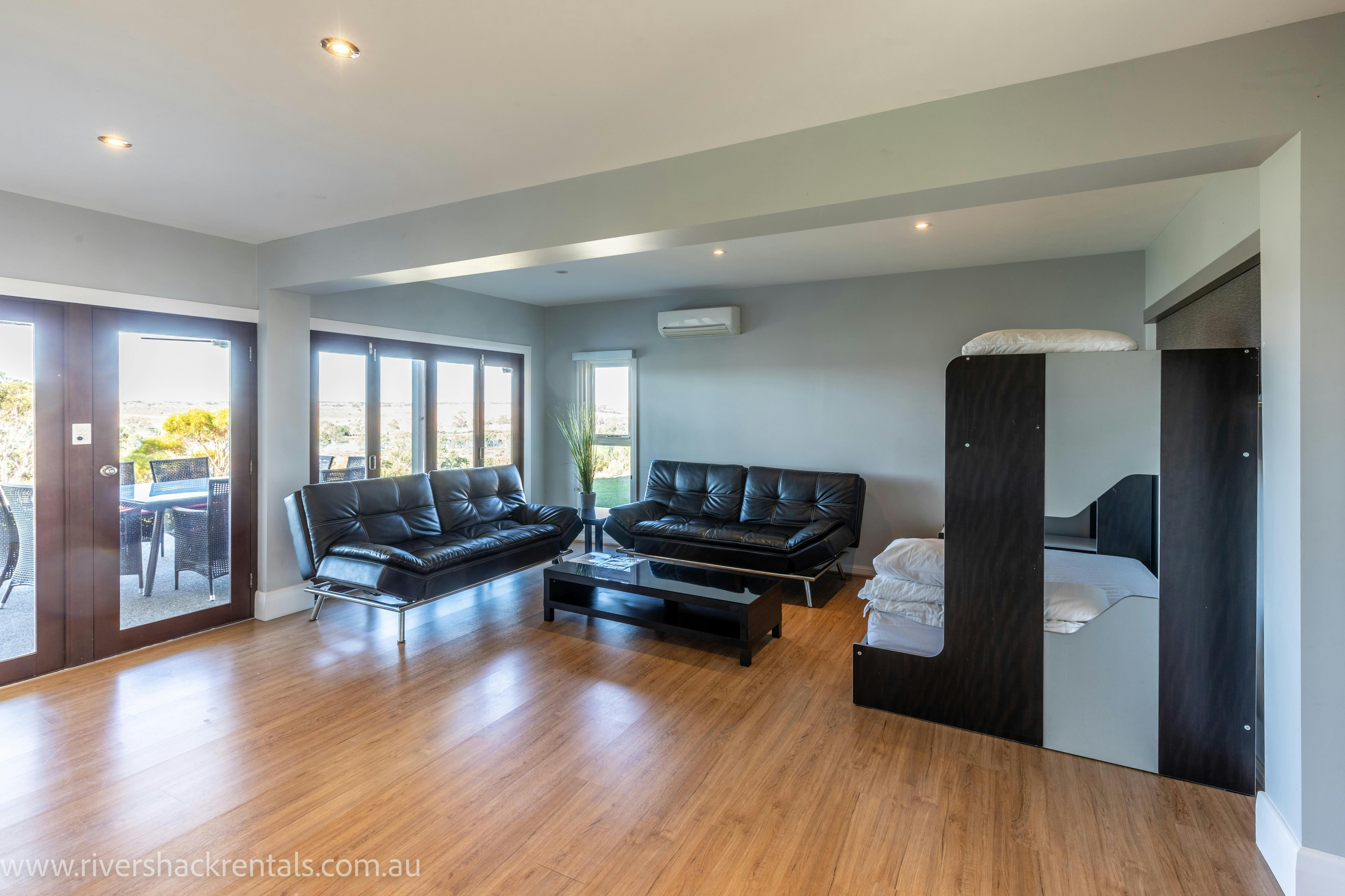 spacious ground level lounge and TV area