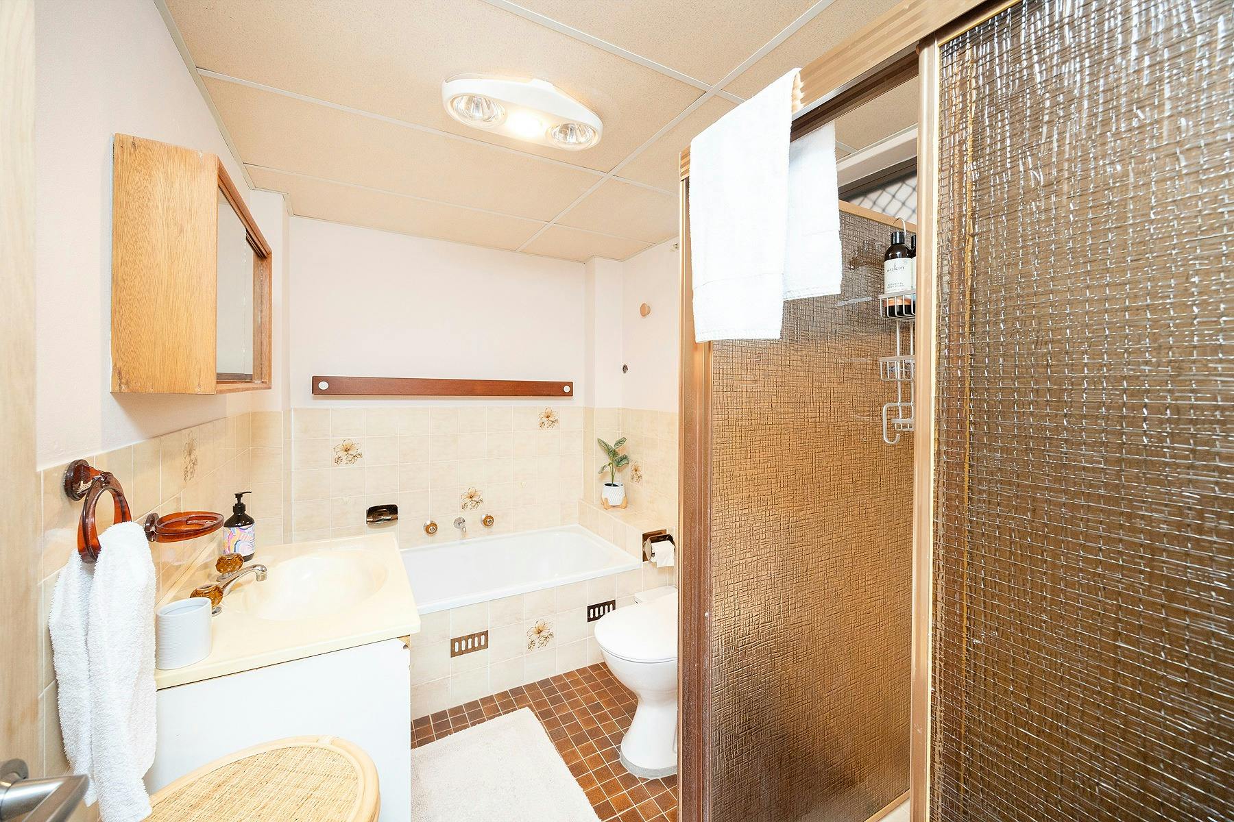Bathroom with bath and shower
