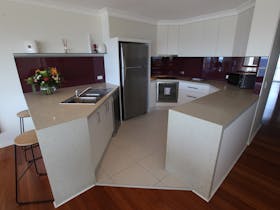 fully equipped kitchen in a 2 Bedroom Ocean View Apartment