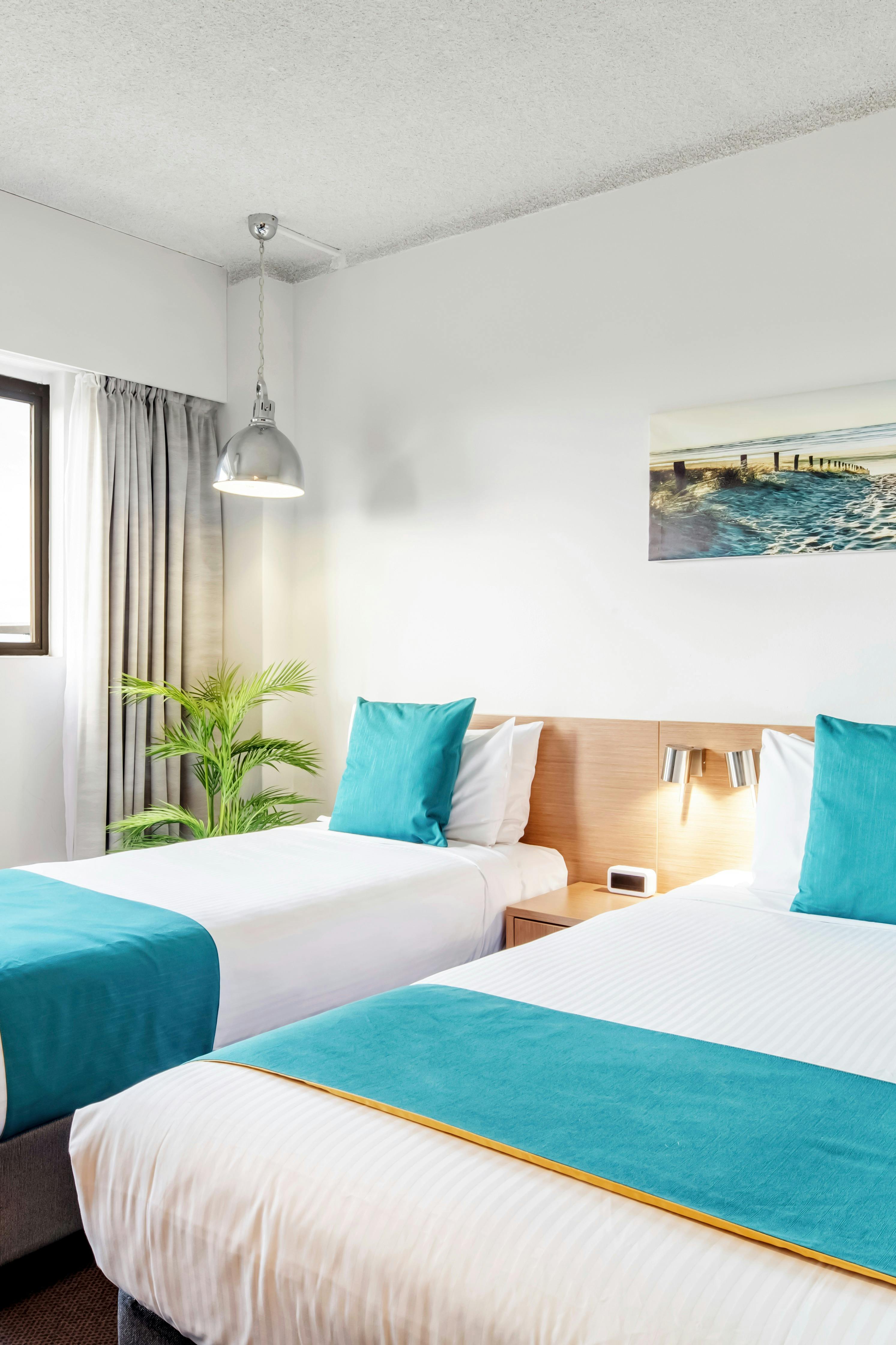 Balcony room with queen & single bed