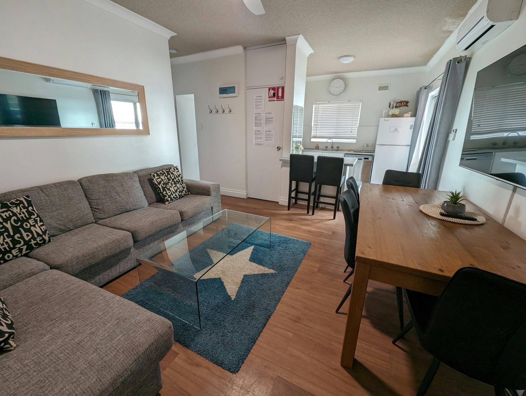 Living area with lounge and dining setting