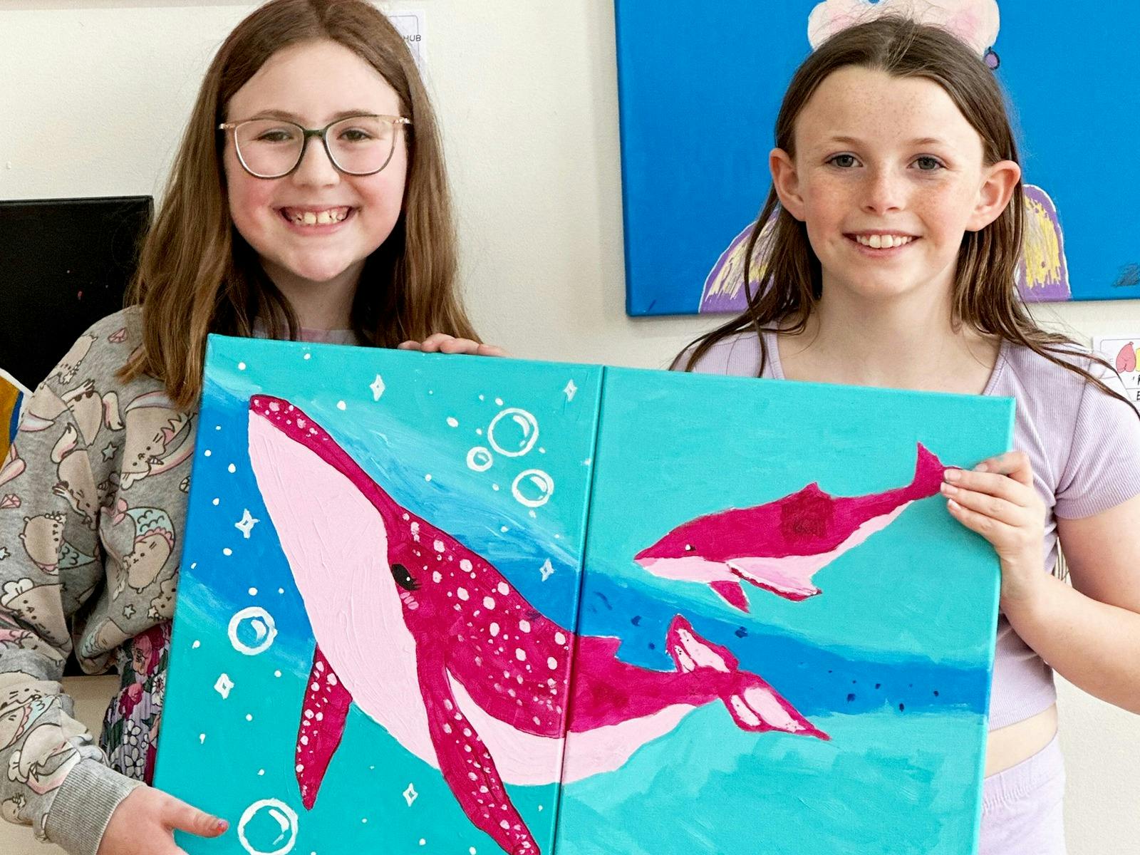 Friends painting a canvas together