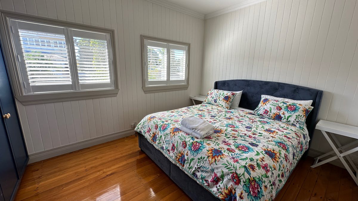 Bedroom with king bed and large wardrobe