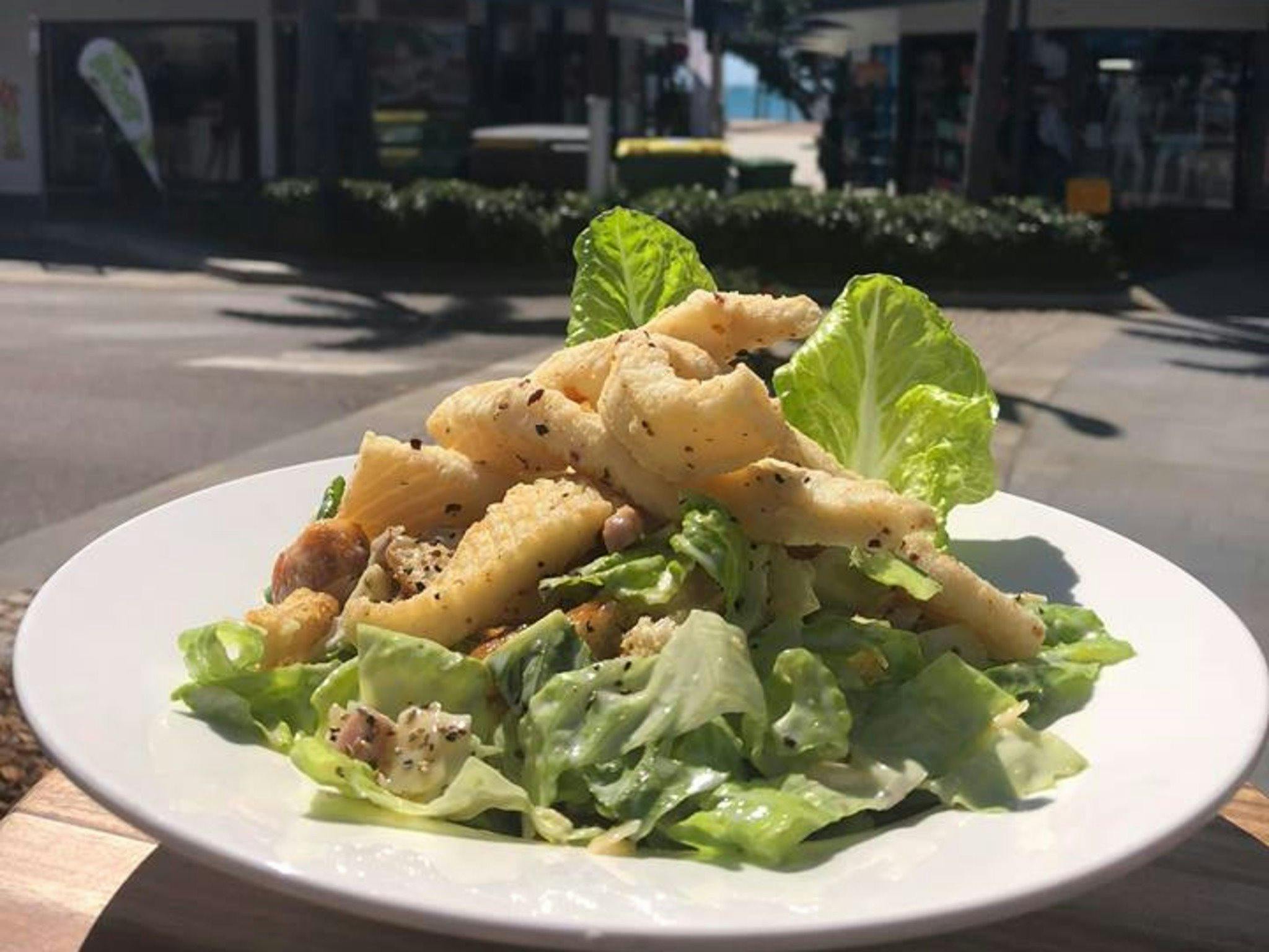 KC's Spiced Calamari on a Caesar Salad