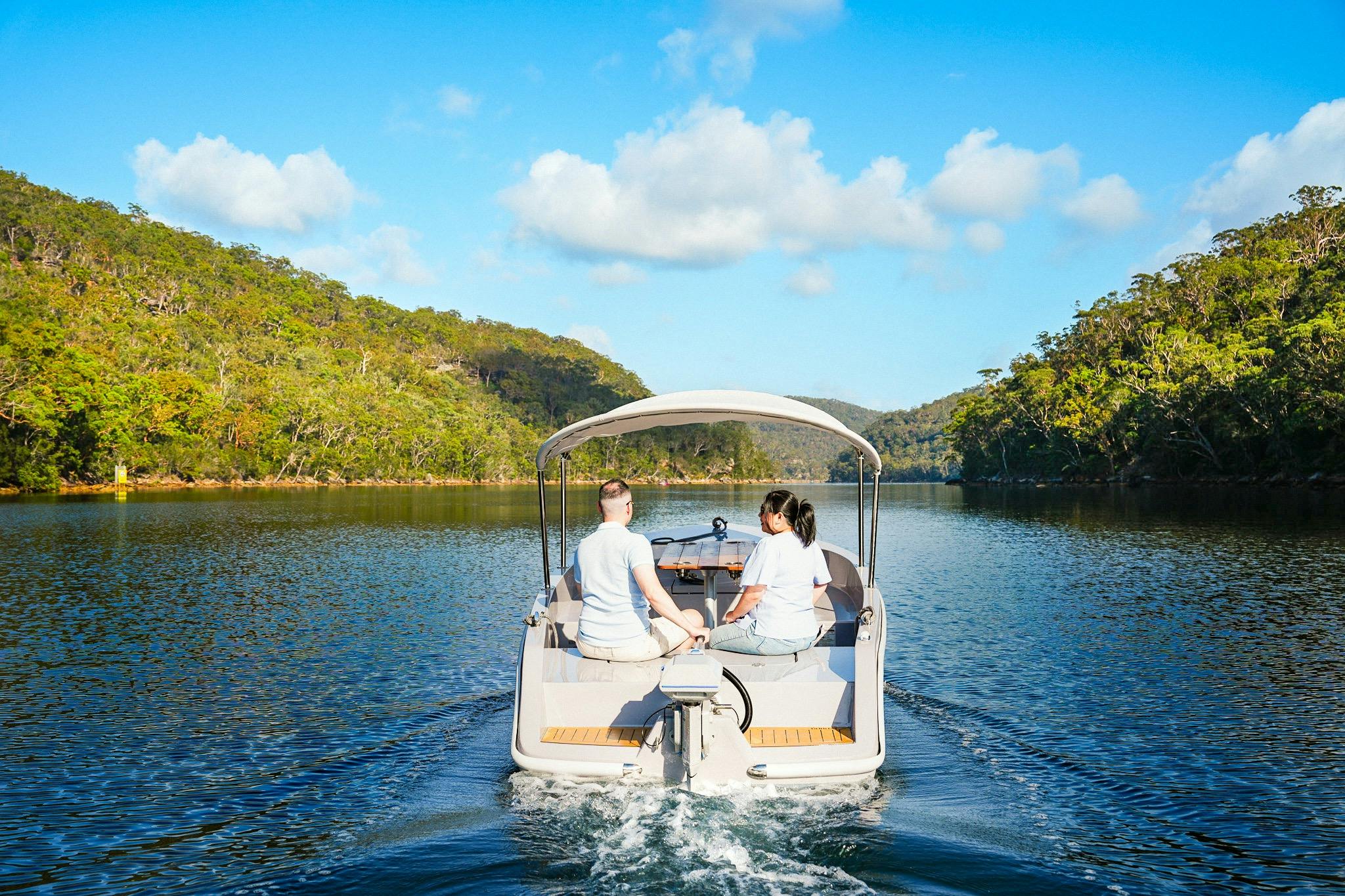 Couple on a GoBoat at Akuna Bay in Ku-ring-gai Chase National Park.