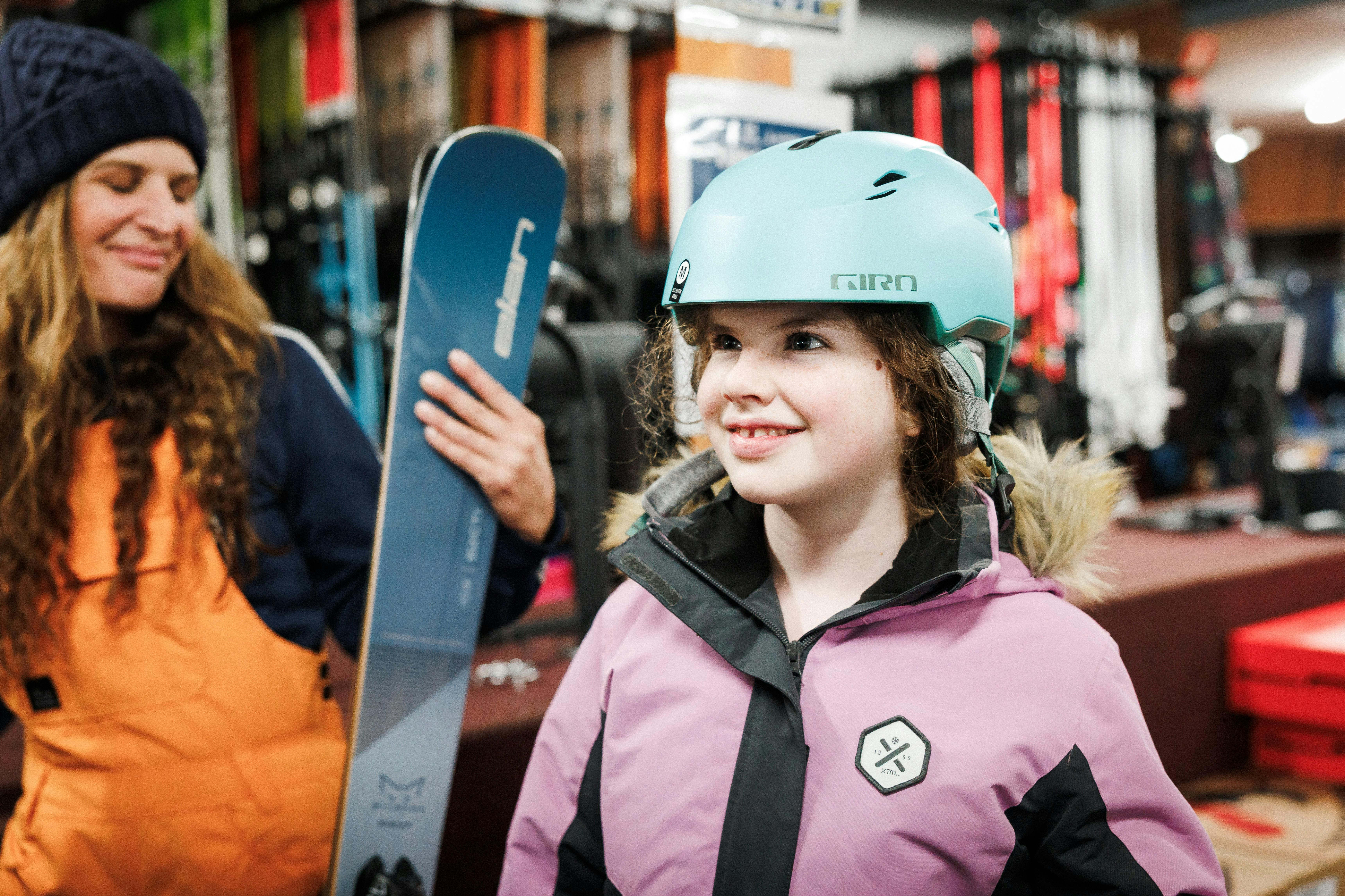 Happy teen trying helmets on