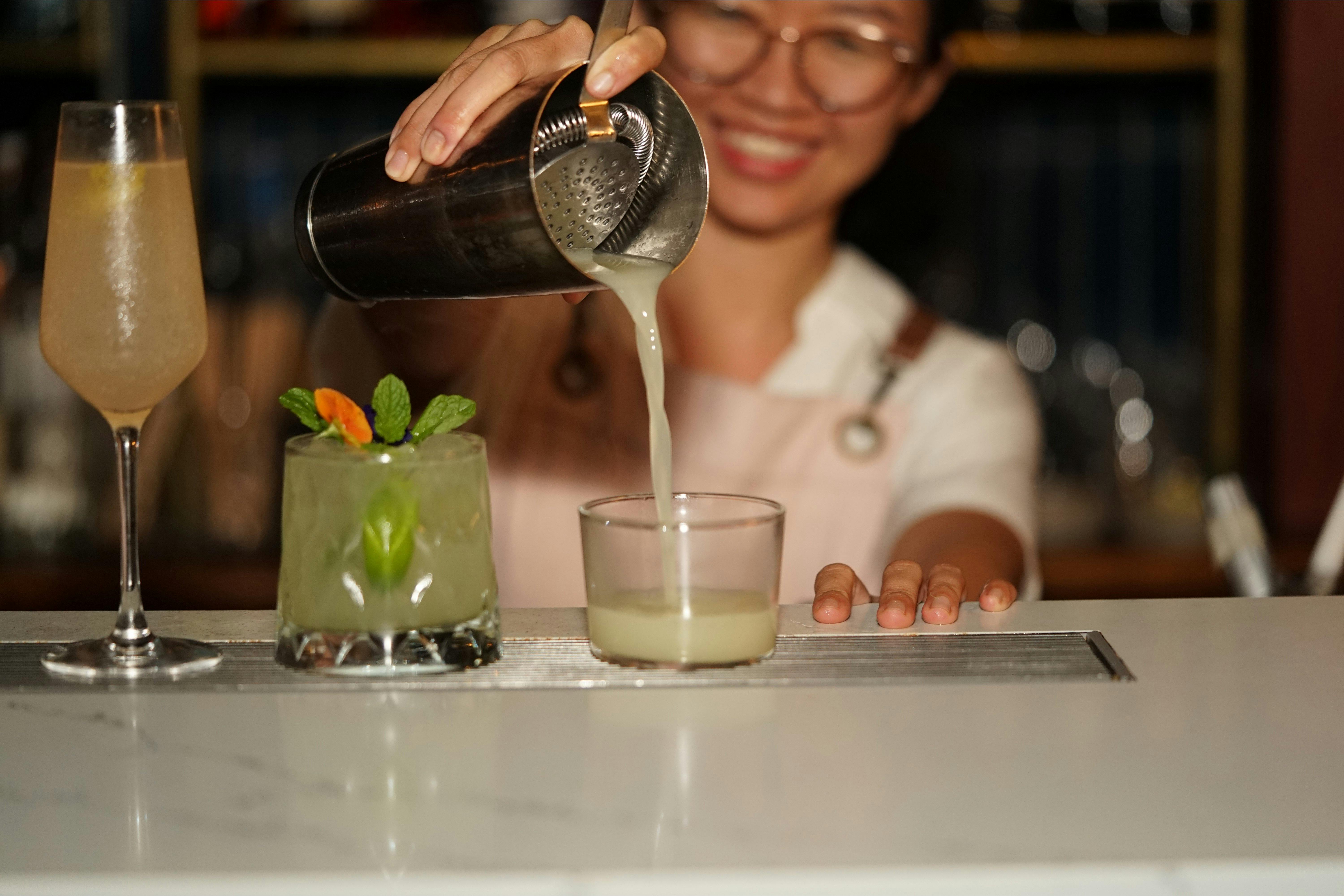Award winning bartender pouring a cocktail