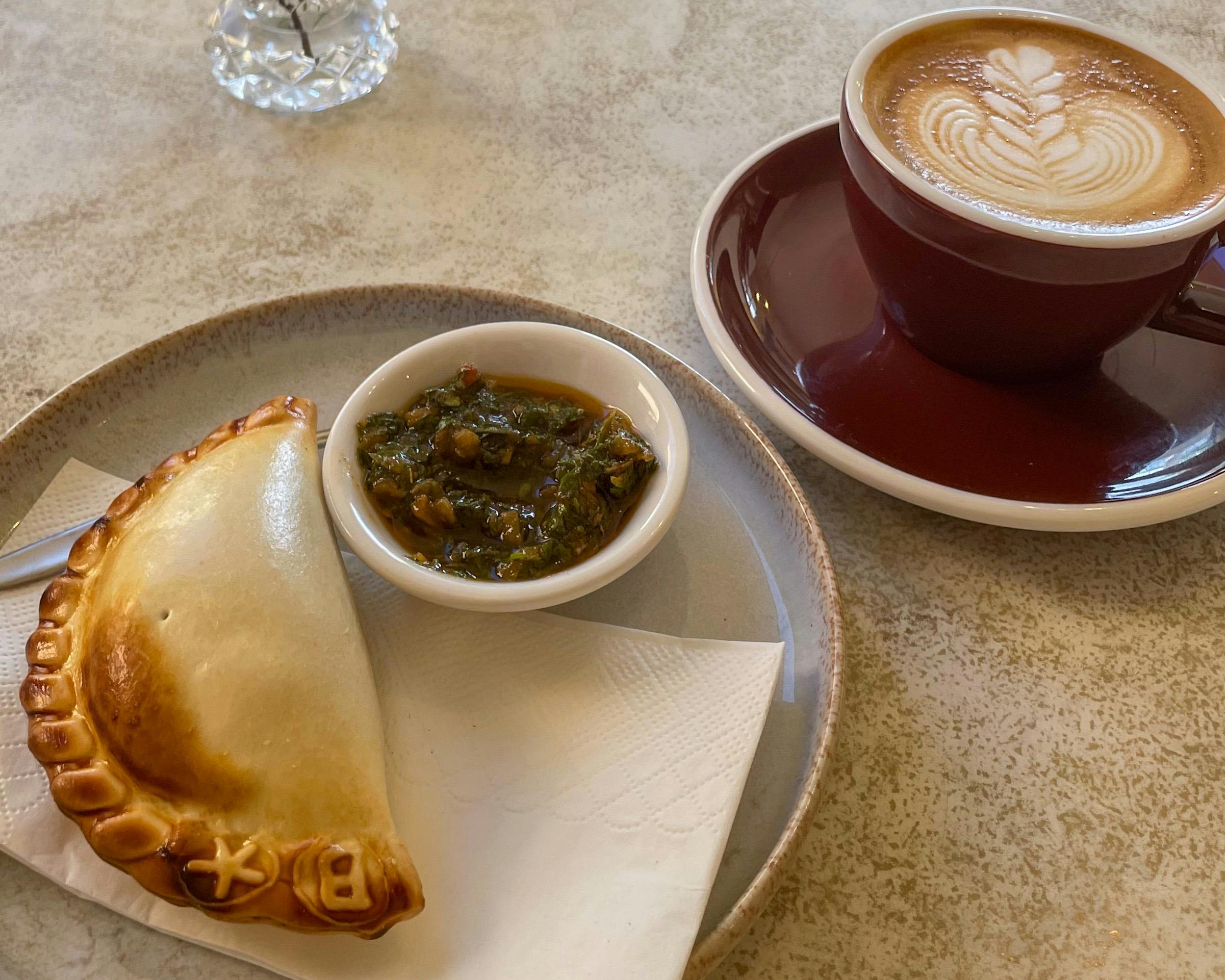 Close up of empanada and coffee