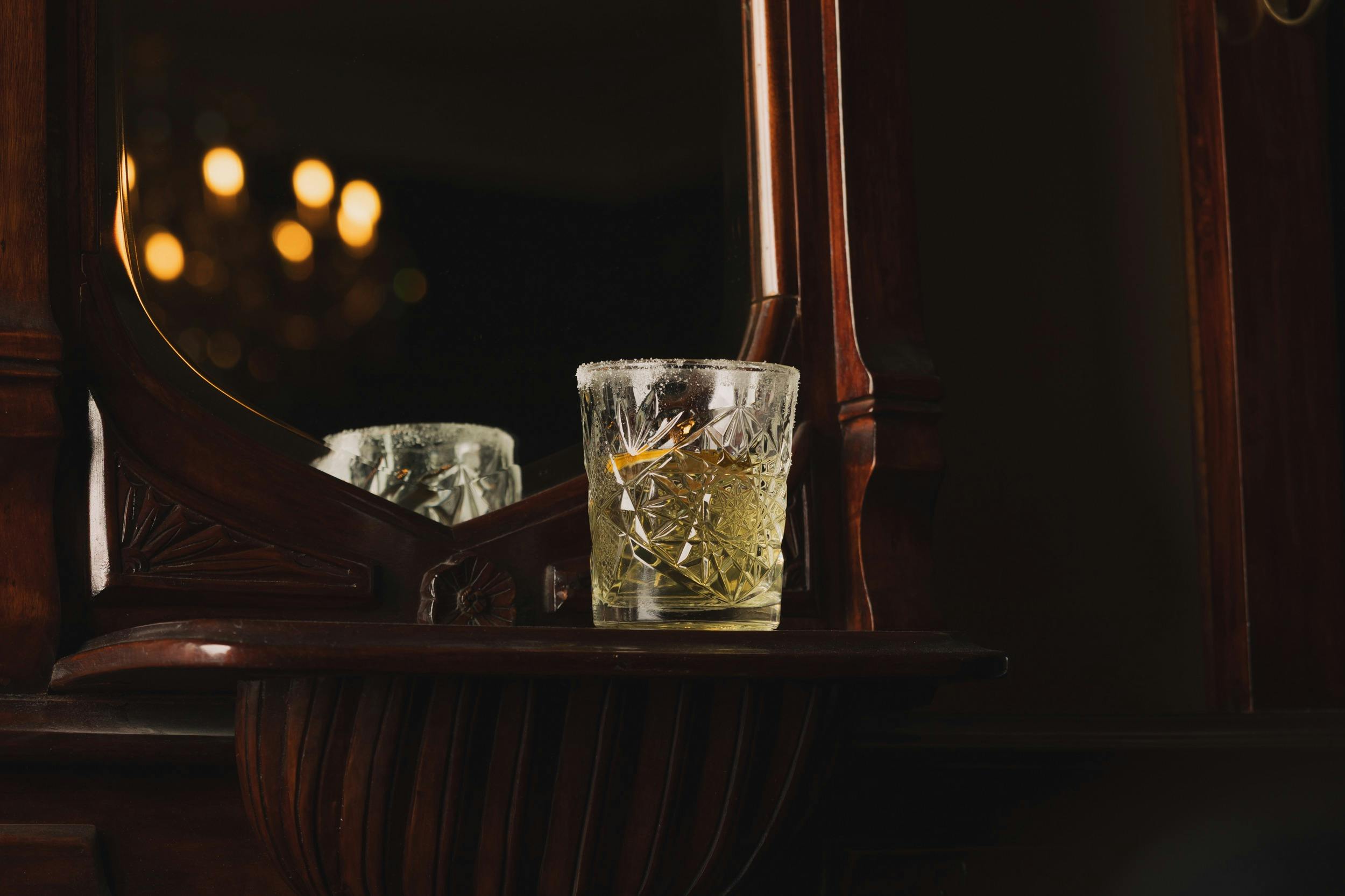 Margarita cocktail next to mirror