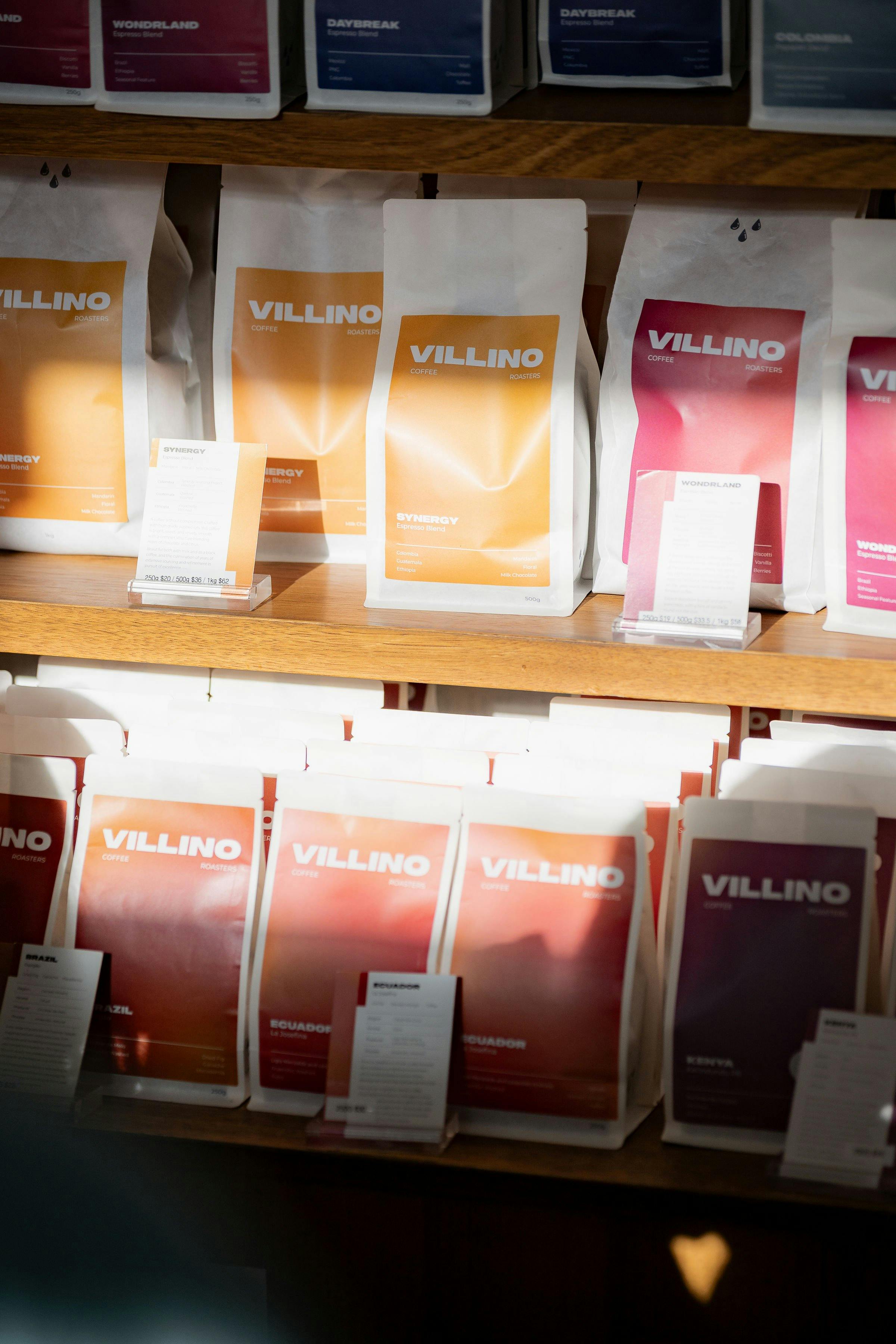 Retail shelves with bags of coffee beans