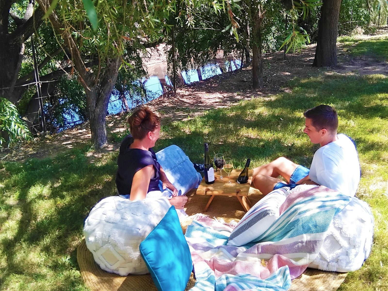 Enjoy a picnic on the banks of the King River with a glass of John Gehrig Wines in the King Valley