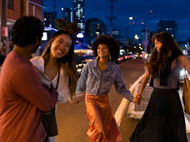 Friends walking through Little India in Harris Park