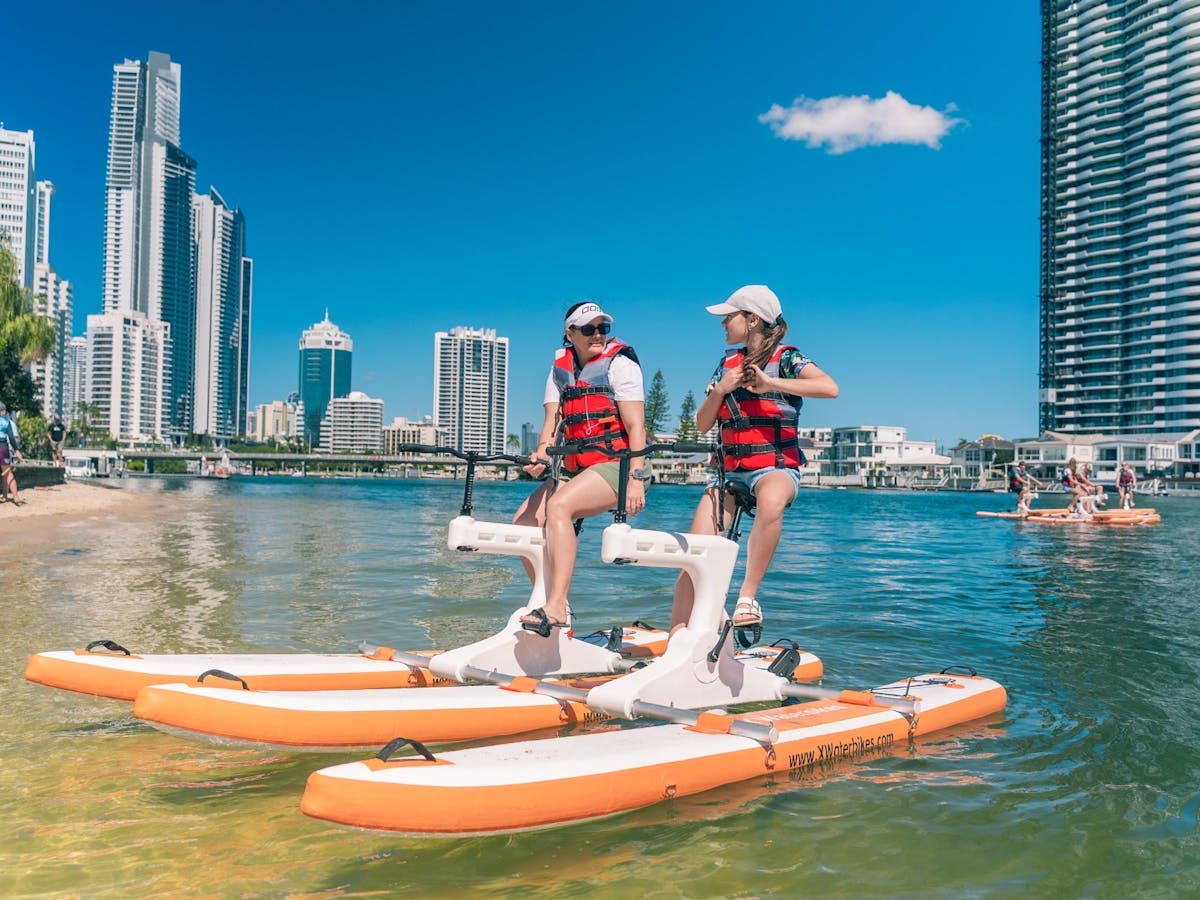 Mother and daughter riding double waterbike in Surfers Paradise Mother and daughter riding double waterbike in Surfers Paradise