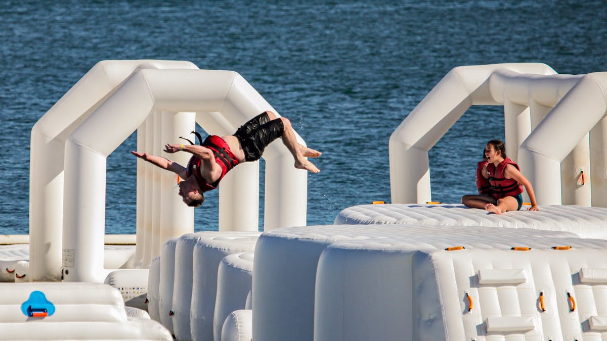 Person back flipping off of obstacle