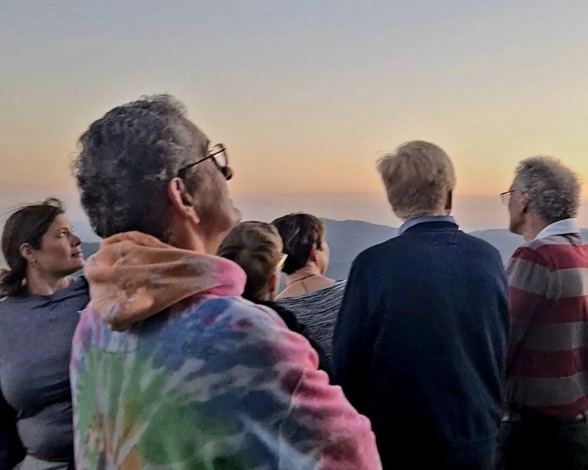 Guests on a stargazing tour watching the sunset