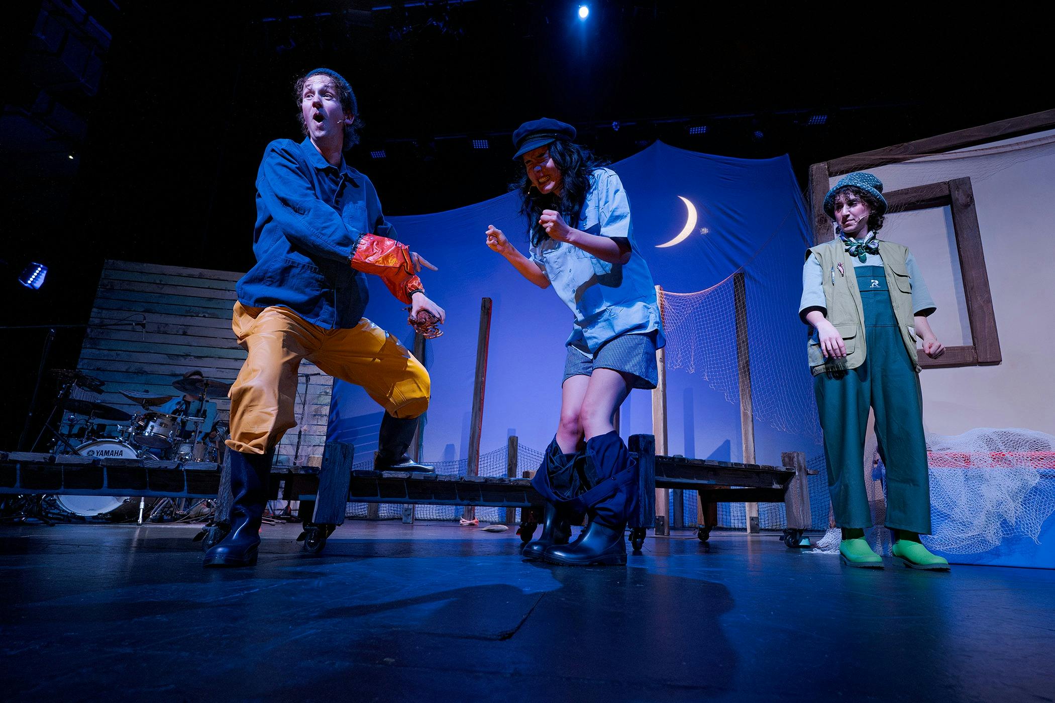 Actors on stage at night