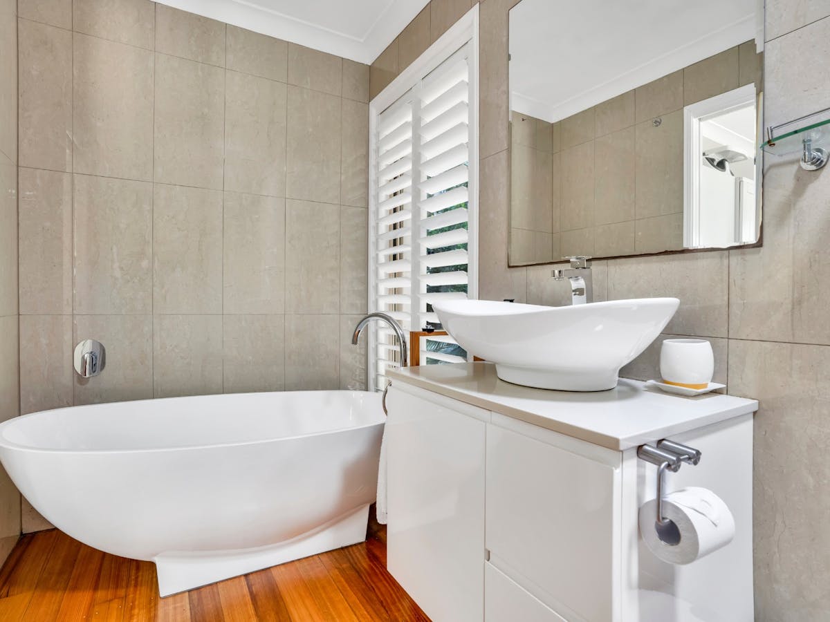 Ensuite bathroom with bath tub and walk-in shower