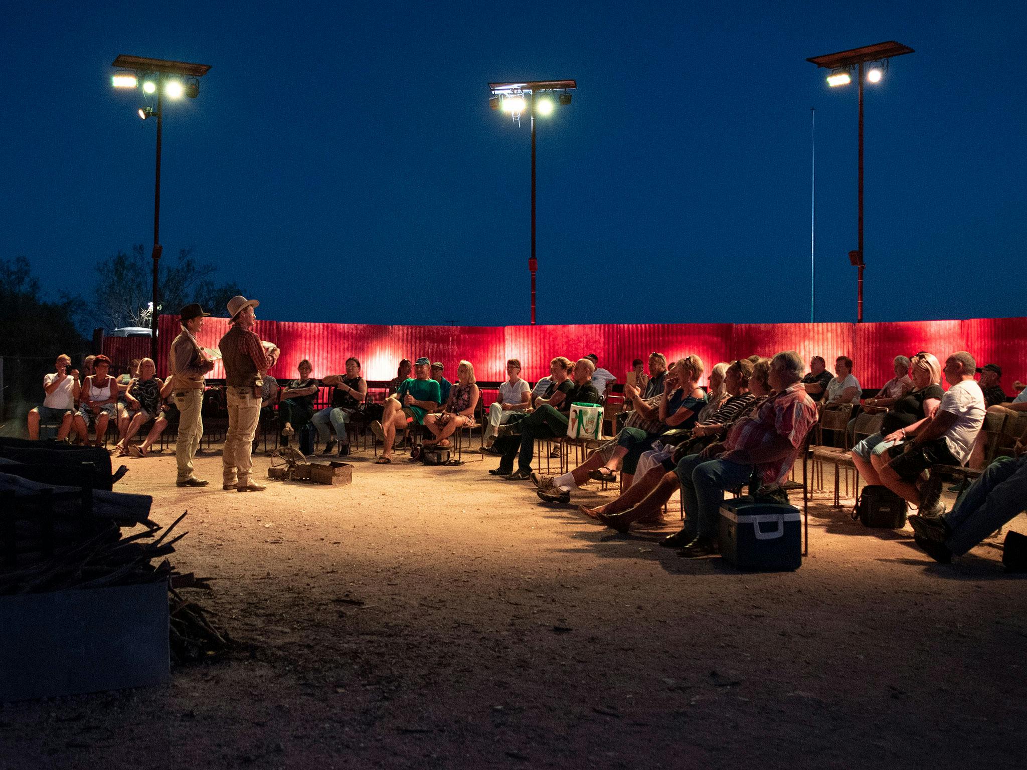 Guests watching live entertainment at Outback Pioneers river camp