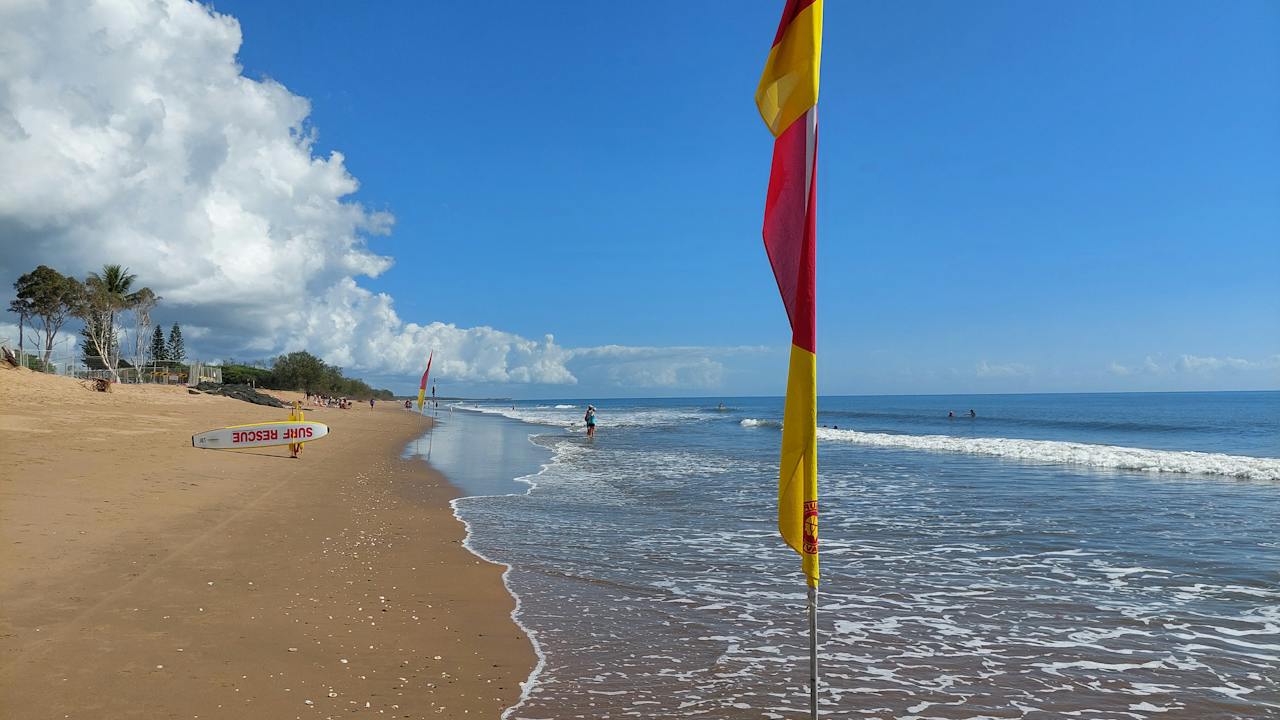 Moore Park Beach, with surf lifesavers on patrol