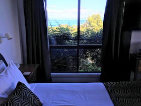 Spectacular sea views from the comfort of your king bed in the Acacia Room.