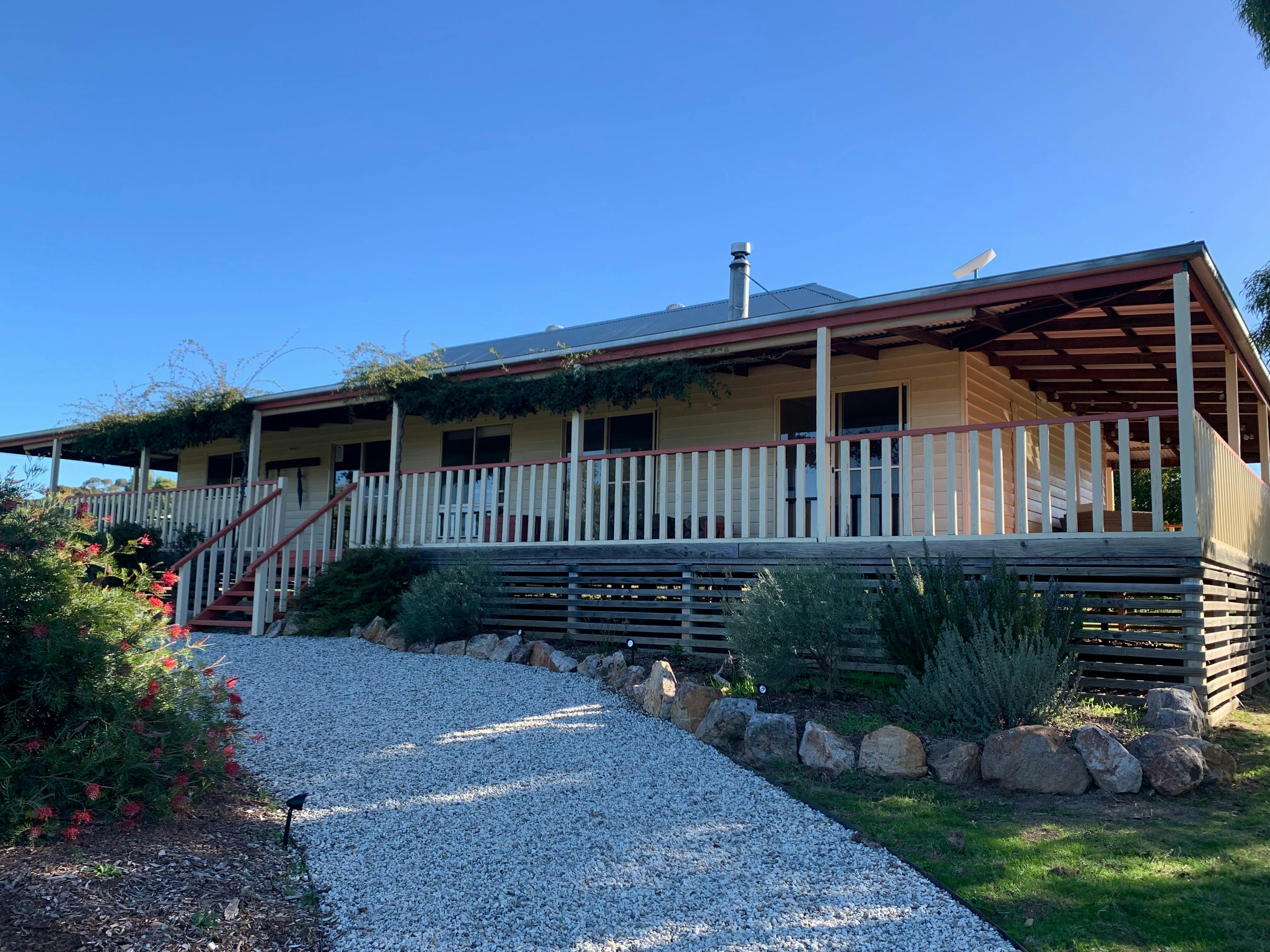 A country home with large verandah in a hilltop setting