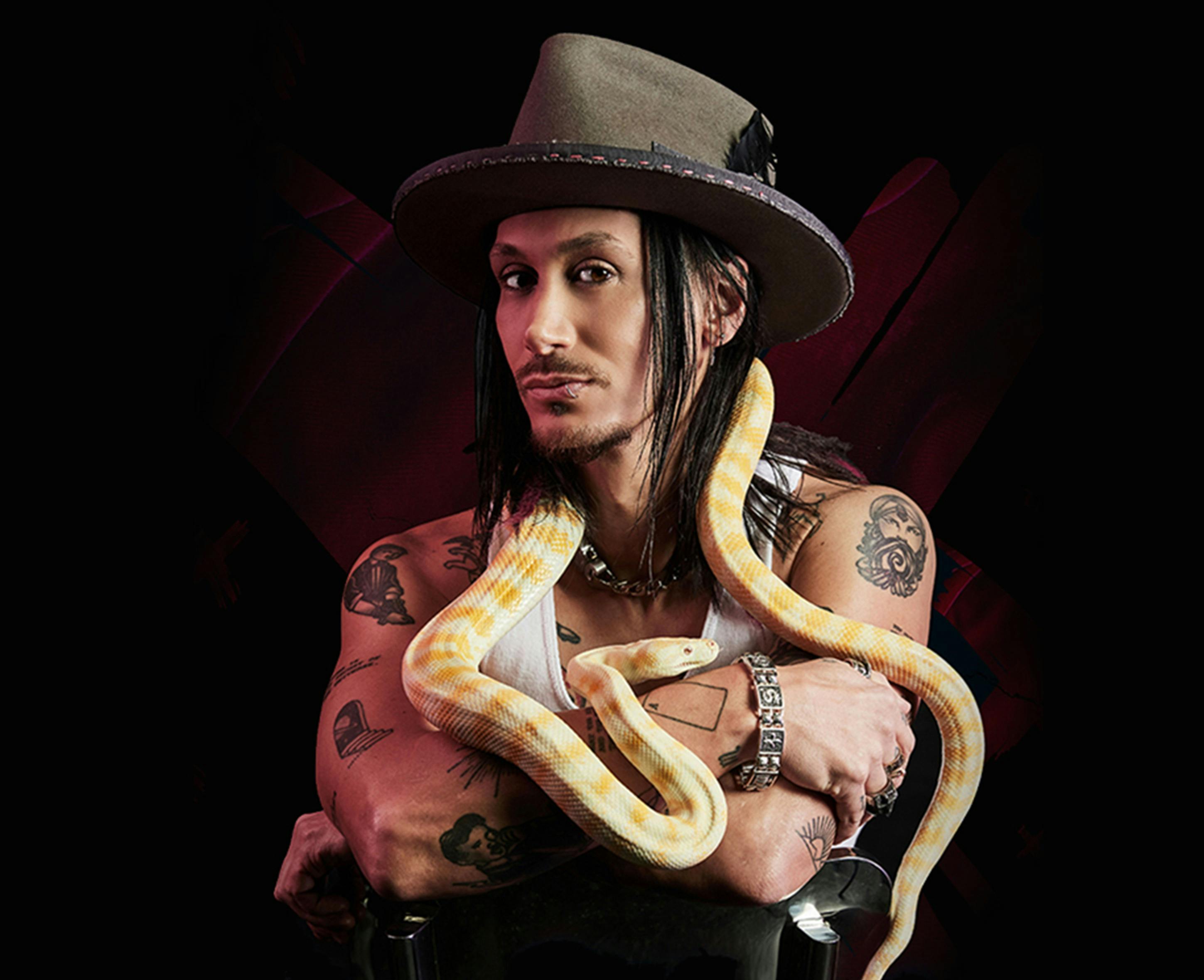 Cosentino poses with a snake.
