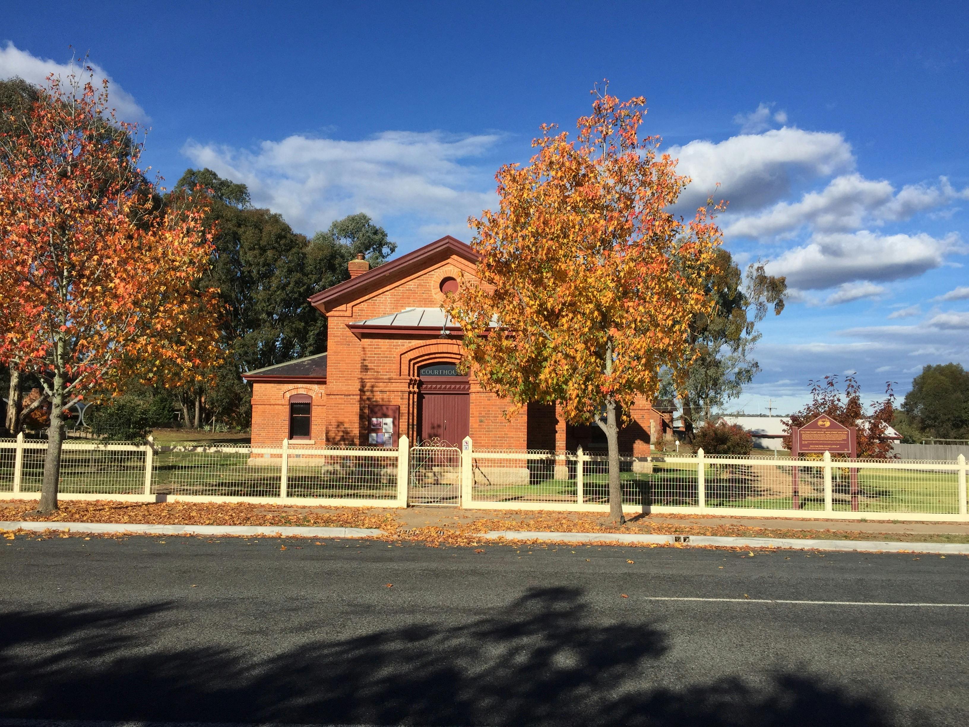 red brick building wheelchair access from rear. steps at front