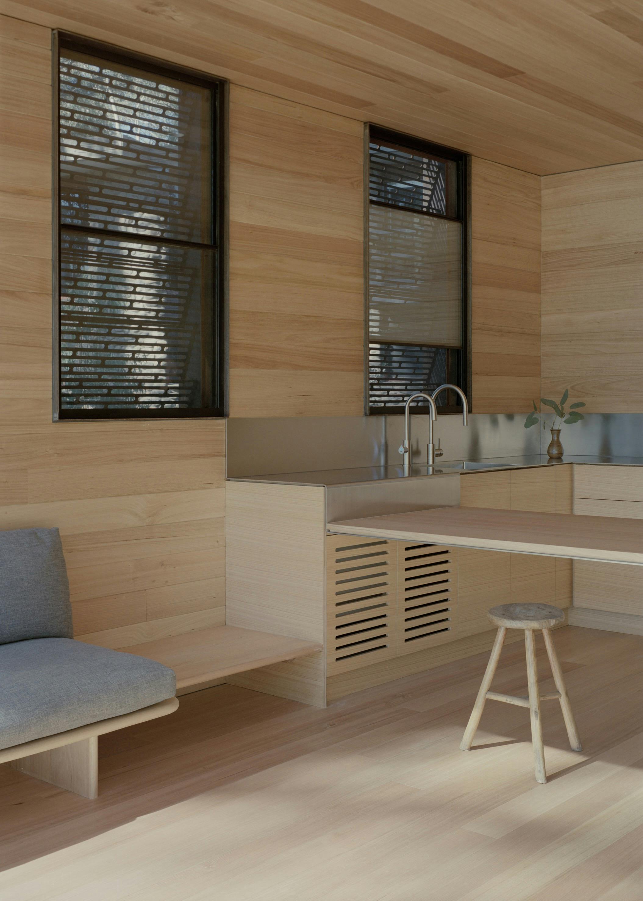 Stunning stainless steel and Tasi oak kitchen living area.  Zip tap, smeg oven, dishwasher, fridge