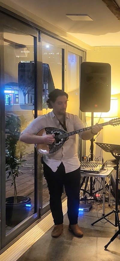 musicians playing inside Kivotos Wine Bar