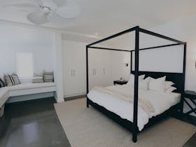 Master bedroom with four poster bed and ensuite