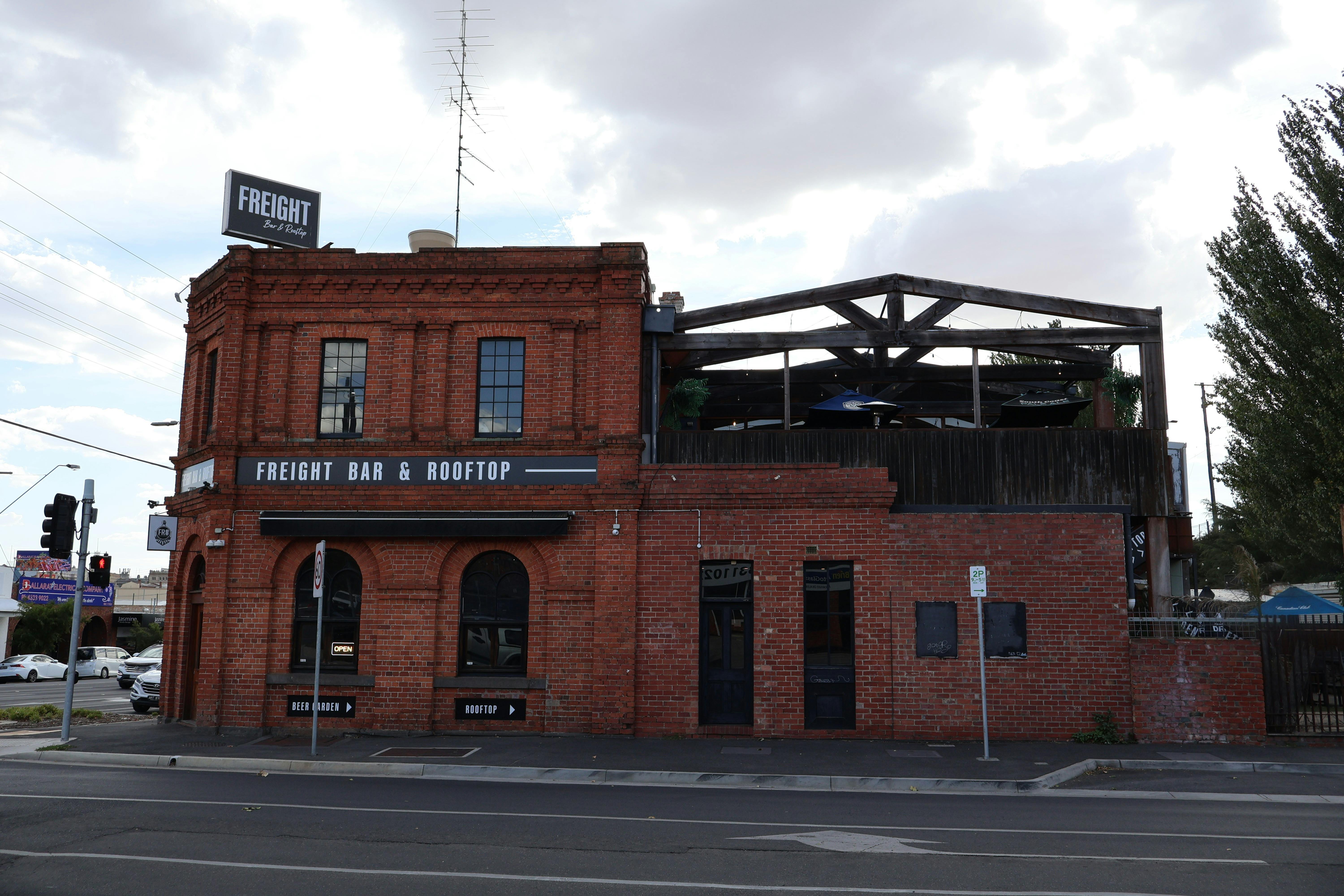 Freight Bar’s industrial-chic exterior and rooftop view.