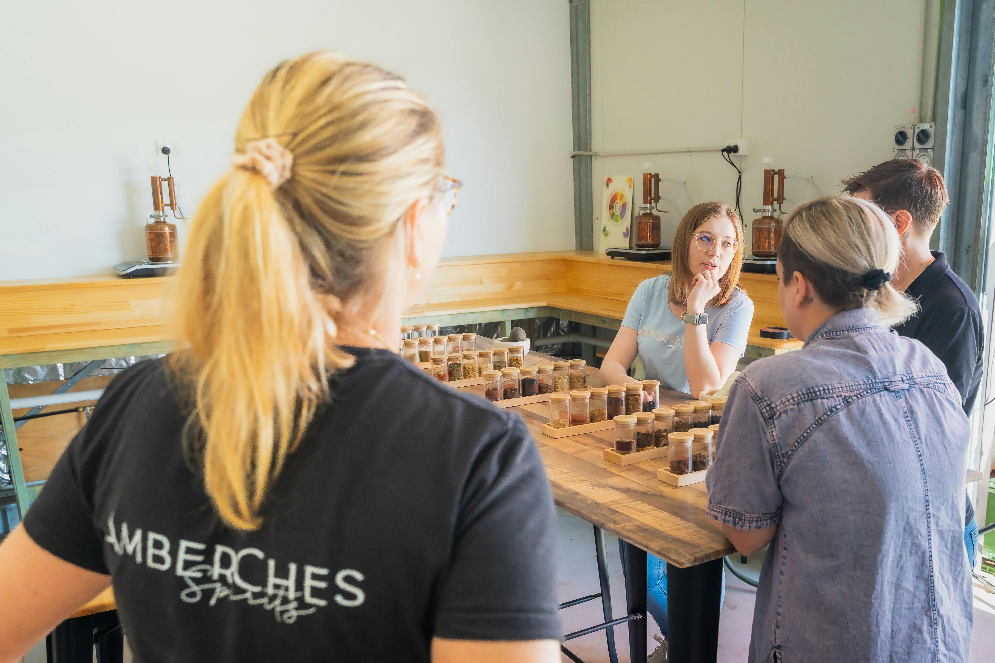 Guests participating in a gin distilling class at AmberChes Spirits Distillery