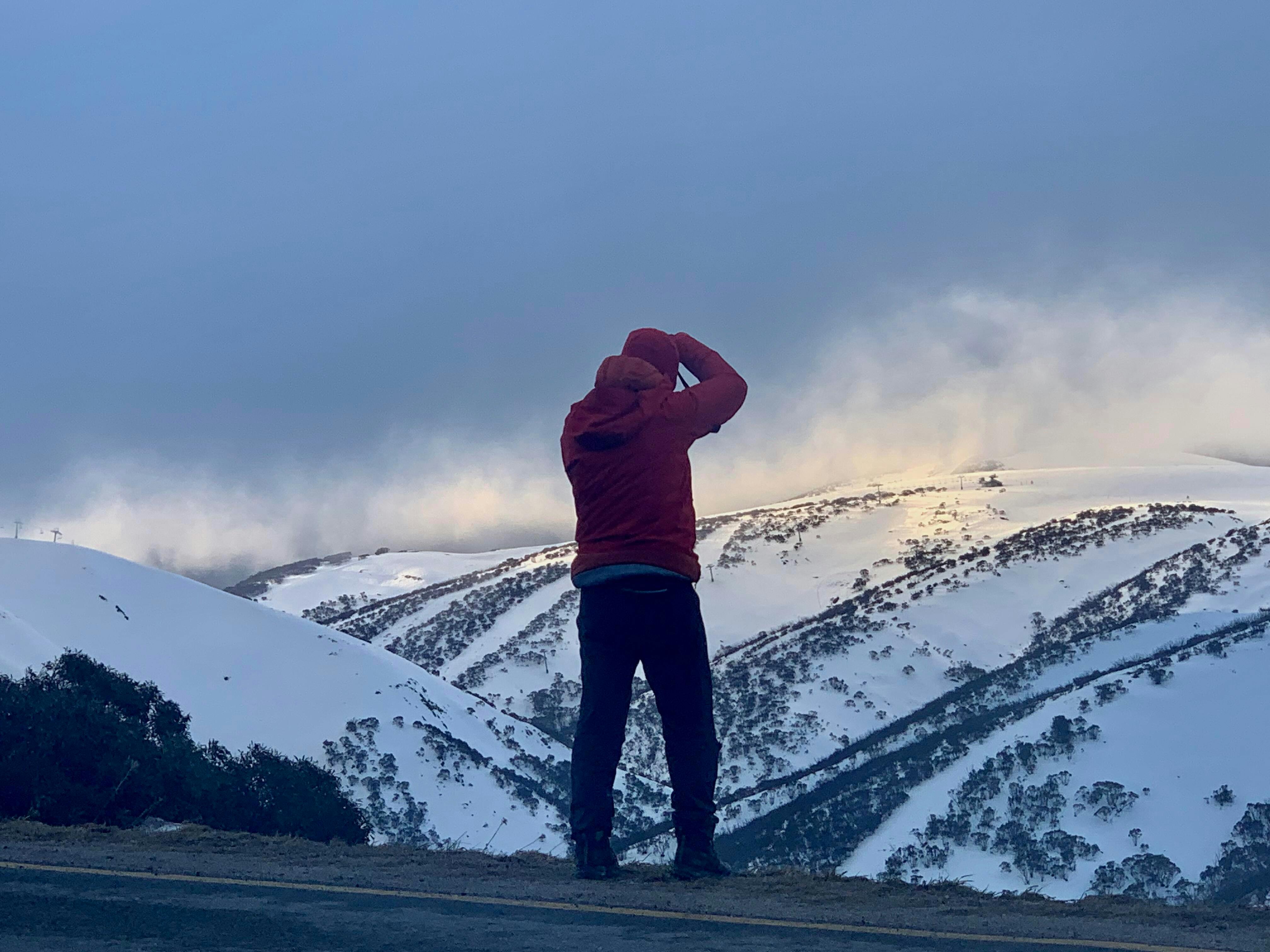 Workshop participant taking a photo during a Winter in the Alpine workshop