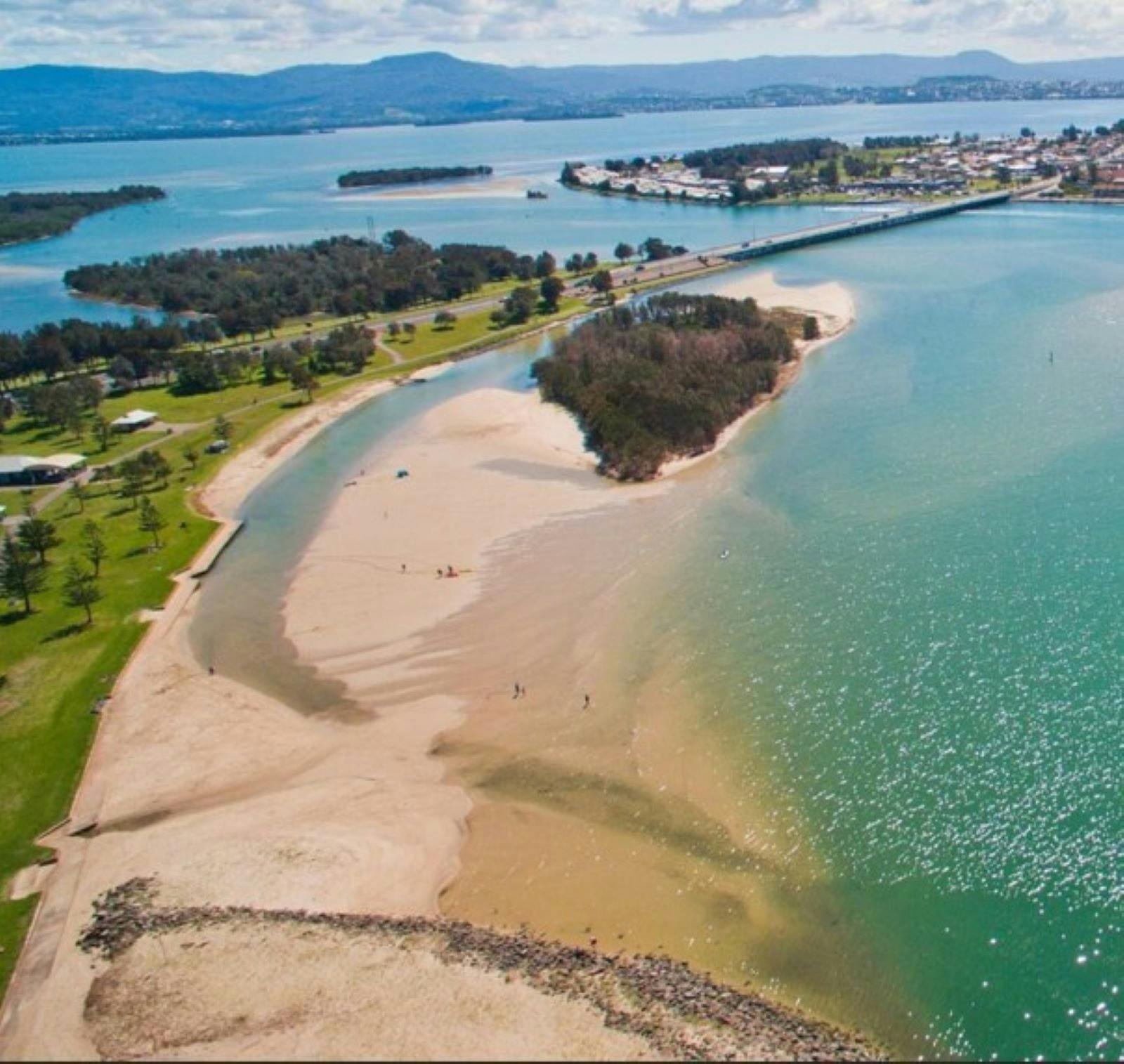 Aerial view of Lake Illawarra with views of Windang Bridge and Berageree Island