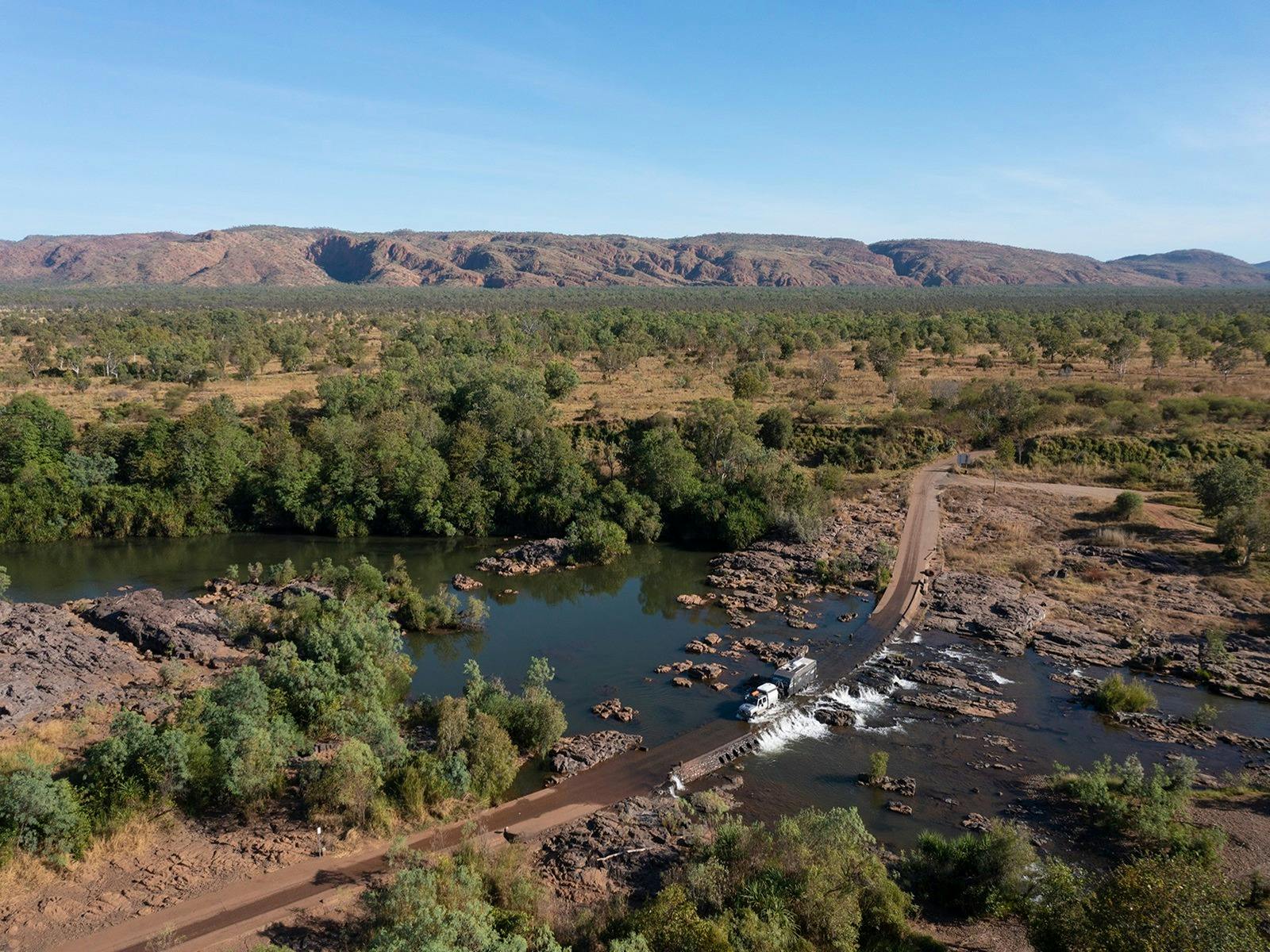 Car and caravan crossing Ivanhoe Crossing near Kununurra Western Australia