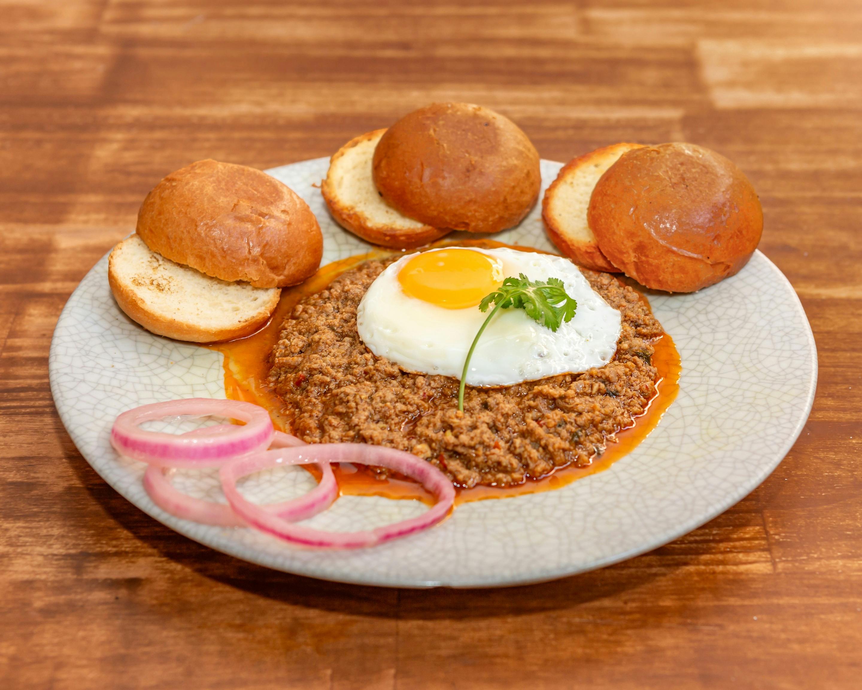 Lamb mince cooked in spices, bombay style & served with buns