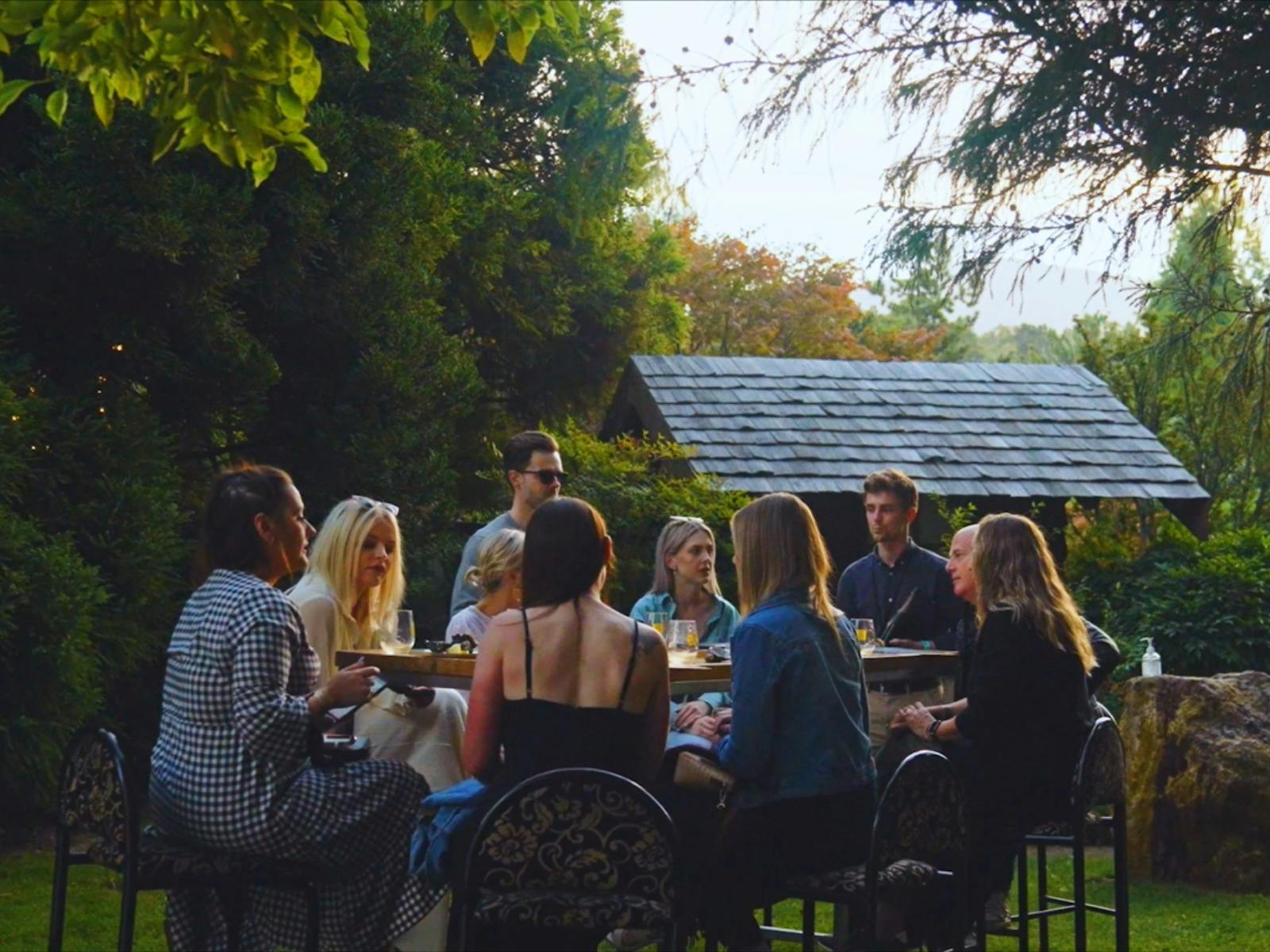 Image of a group of people at a table at the Tasmanian Wine Festival